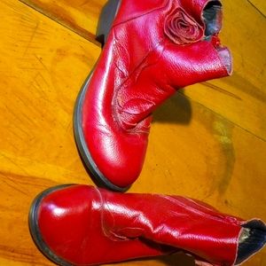 Women's red boots with a flower on the side size seven and a half